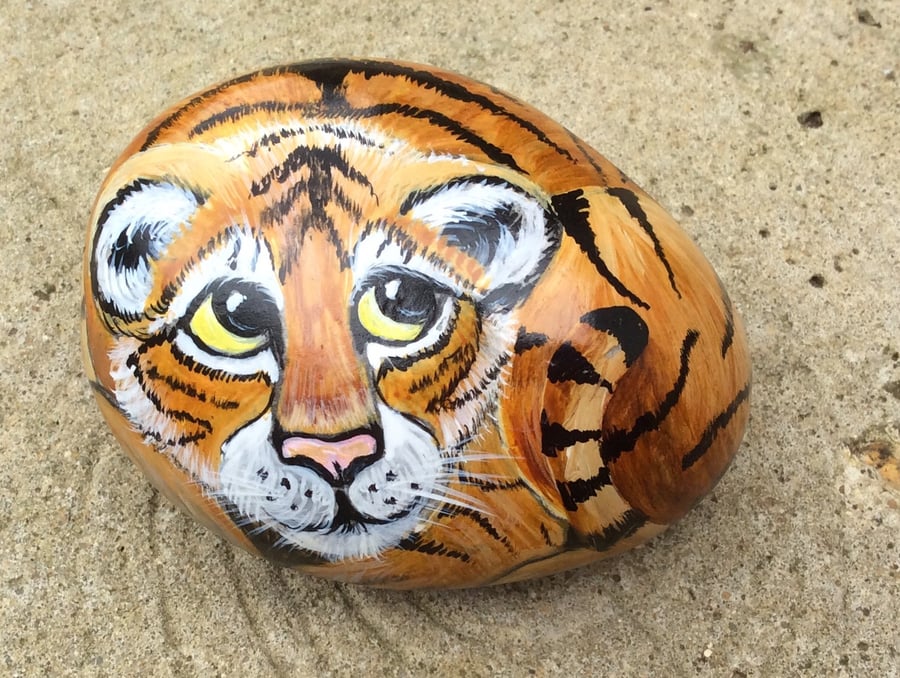 Tiger cub hand painted on rock 