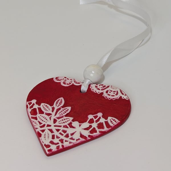 Red love heart clay hanging decoration with textured lace design 