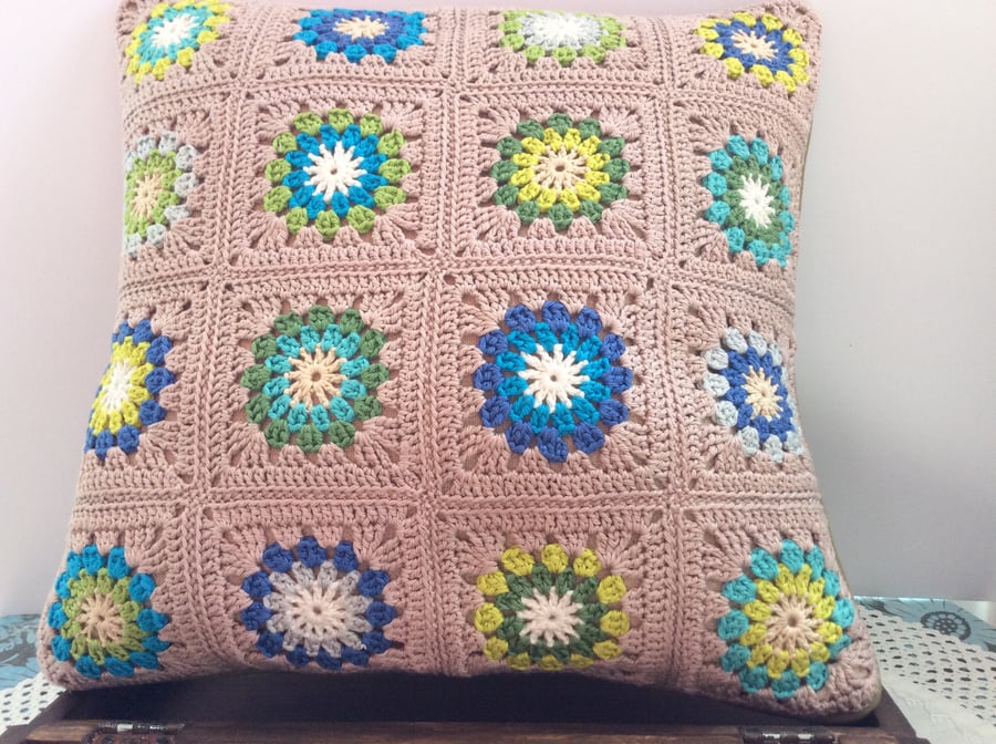 Crochet Cushion in a rich mix of blues, greens and creams. Free UK P & P.