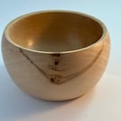 A medium sized wooden Bowl