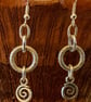Metal frosted loop earrings with spiral charms - Image 1