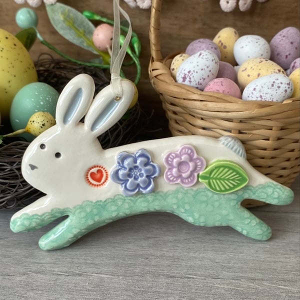 Ceramic Leaping Bunny decoration with flowers turquoise