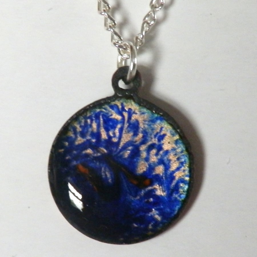 small round pendant - scrolled red on blue over clear enamel No2