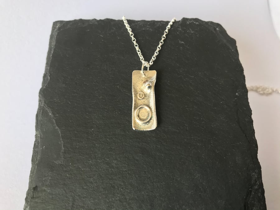 Unique reticulated rectangular silver pendant