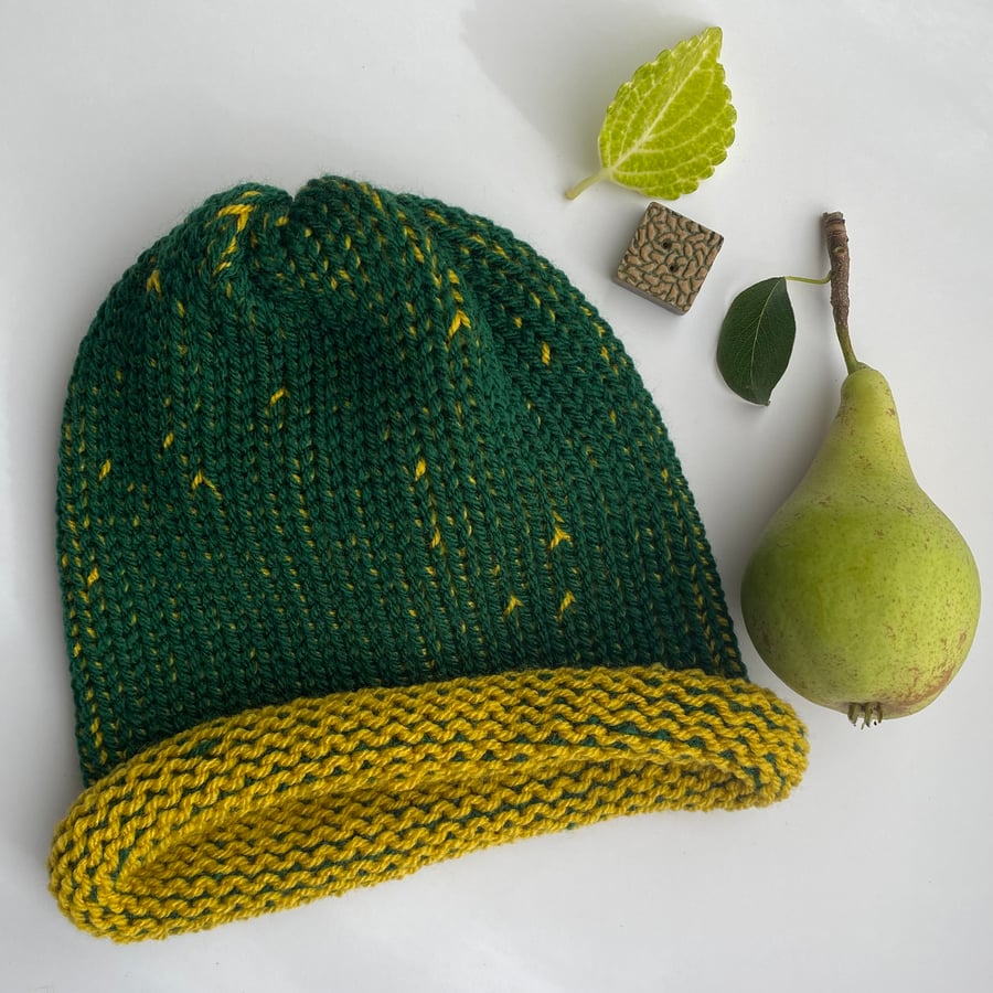 Knitted green and yellow beanie hat