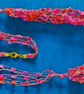 Crocheted necklace in shades of deep pink with a touch of gold, lightweight  - Image 3