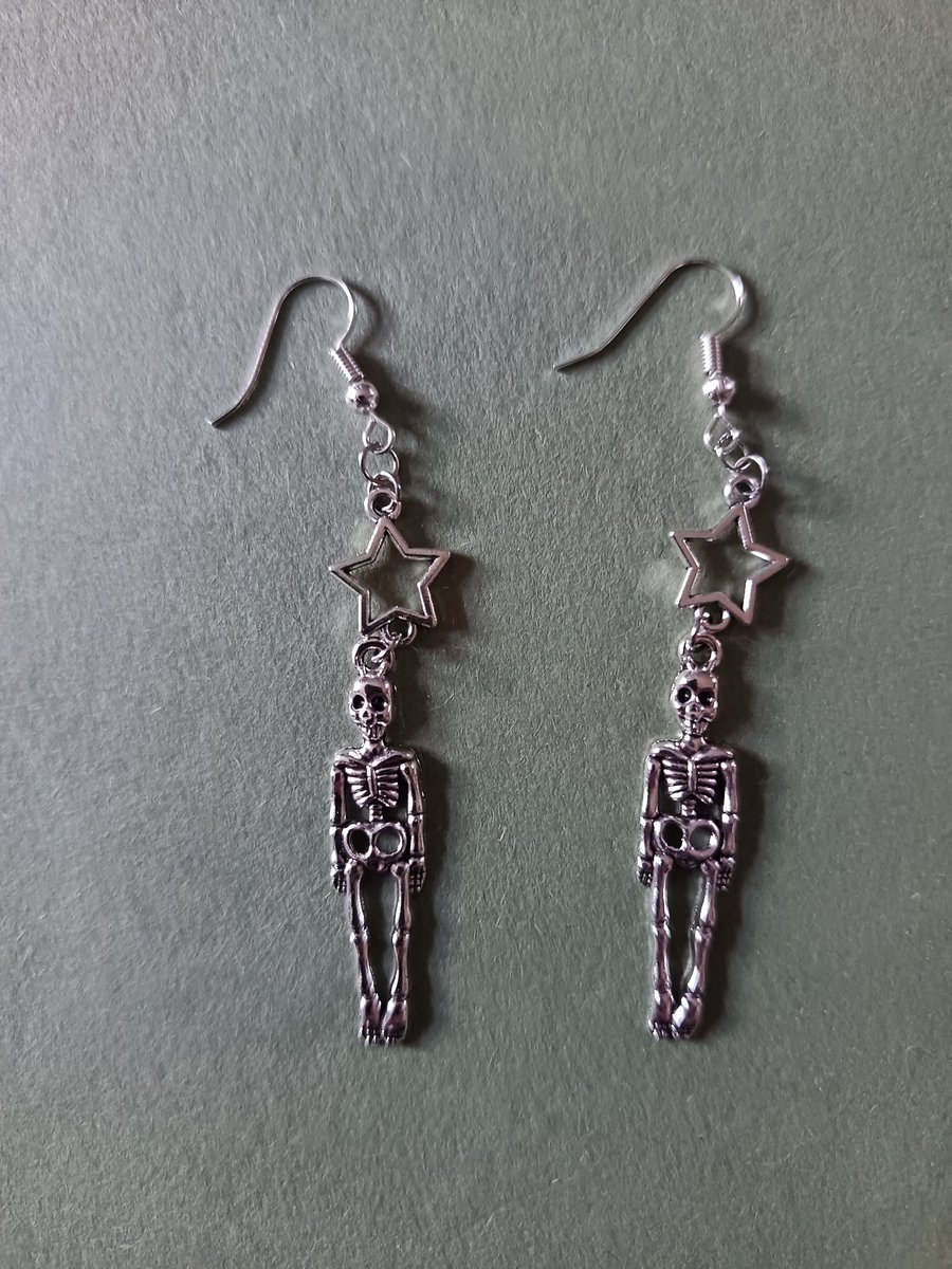 Silver skeleton and star dangle earrings 