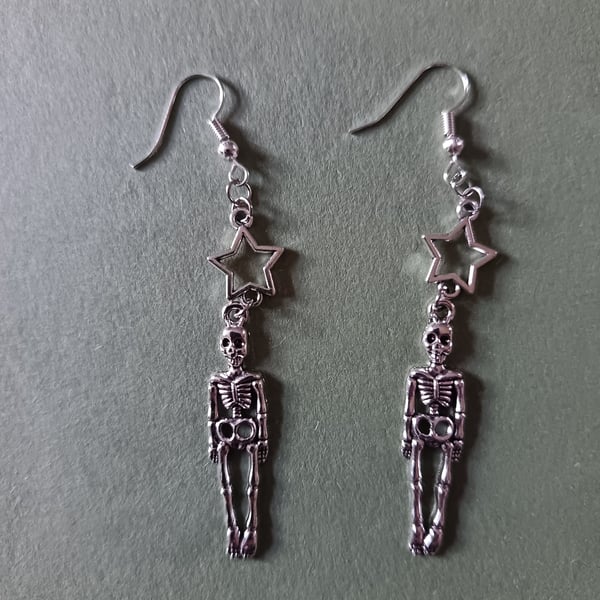 Silver skeleton and star dangle earrings 