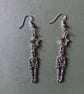 Silver skeleton and star dangle earrings 