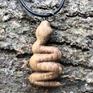 Hand carved oak snake pendant