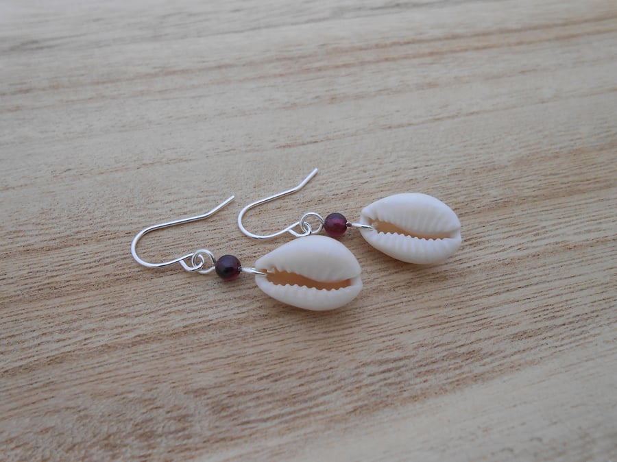 Cowrie shell earrings with garnet bead. Silver plated women's sea shell earrings