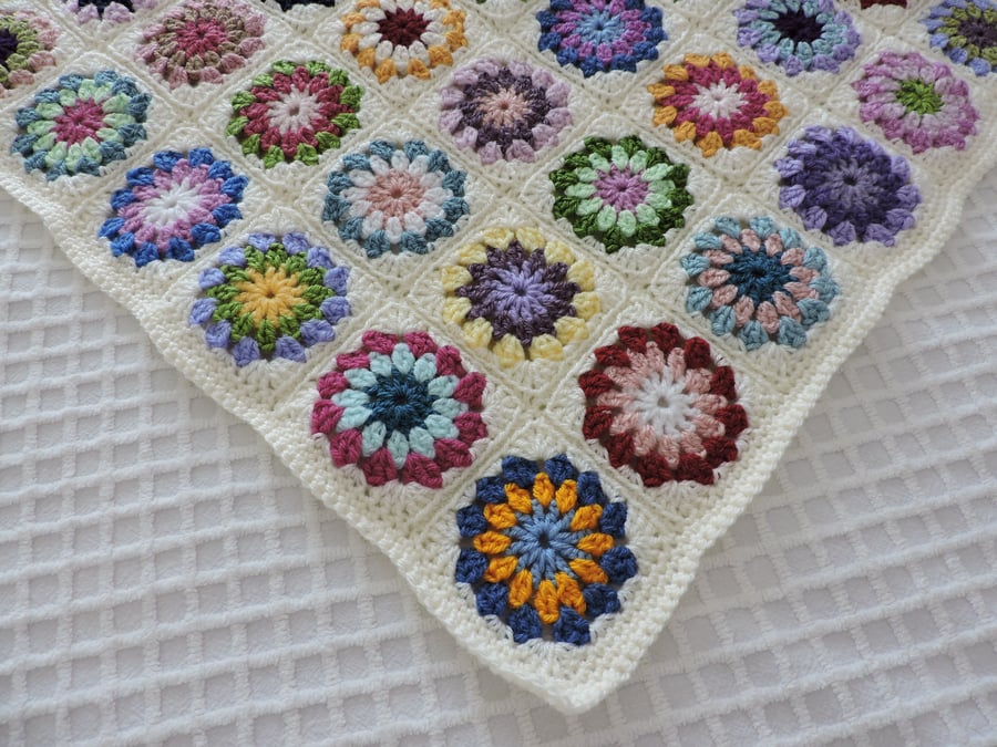 Crochet Baby Blanket in Granny Square Rainbow Rosettes