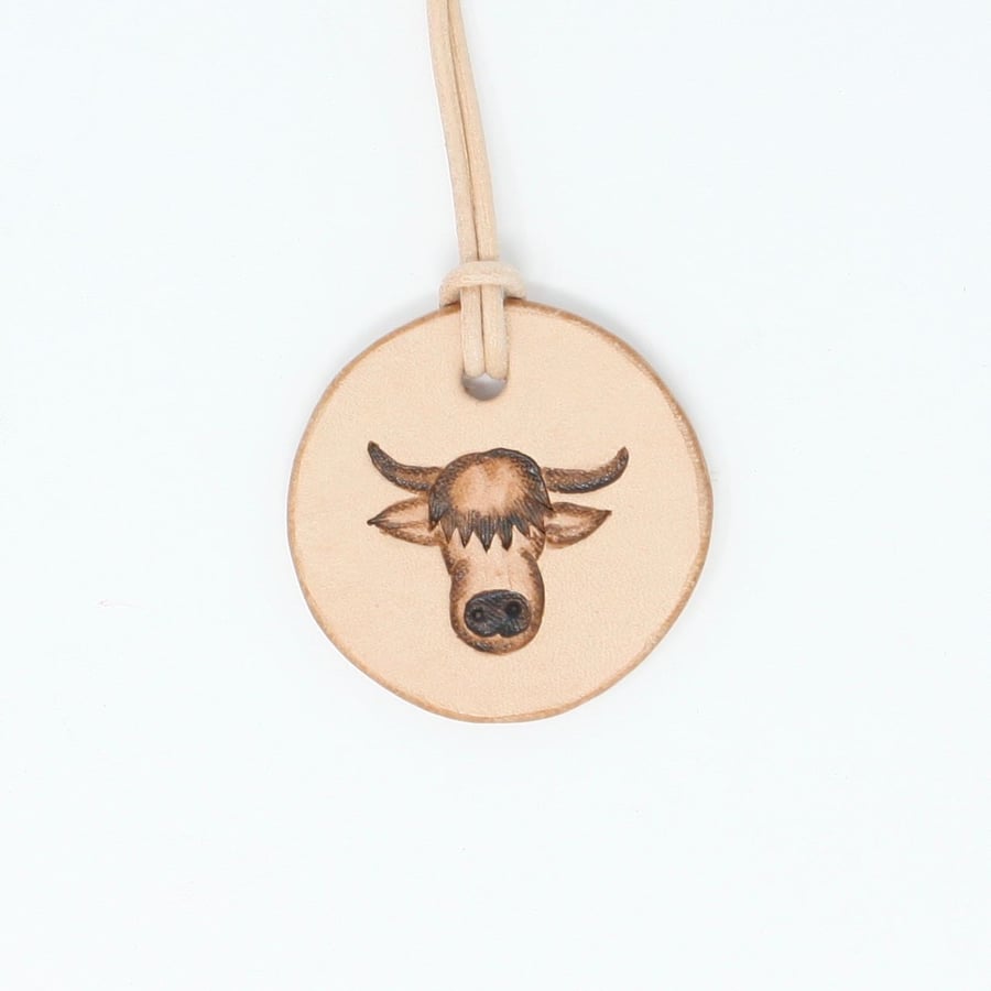 Leather pendant with highland coo motif
