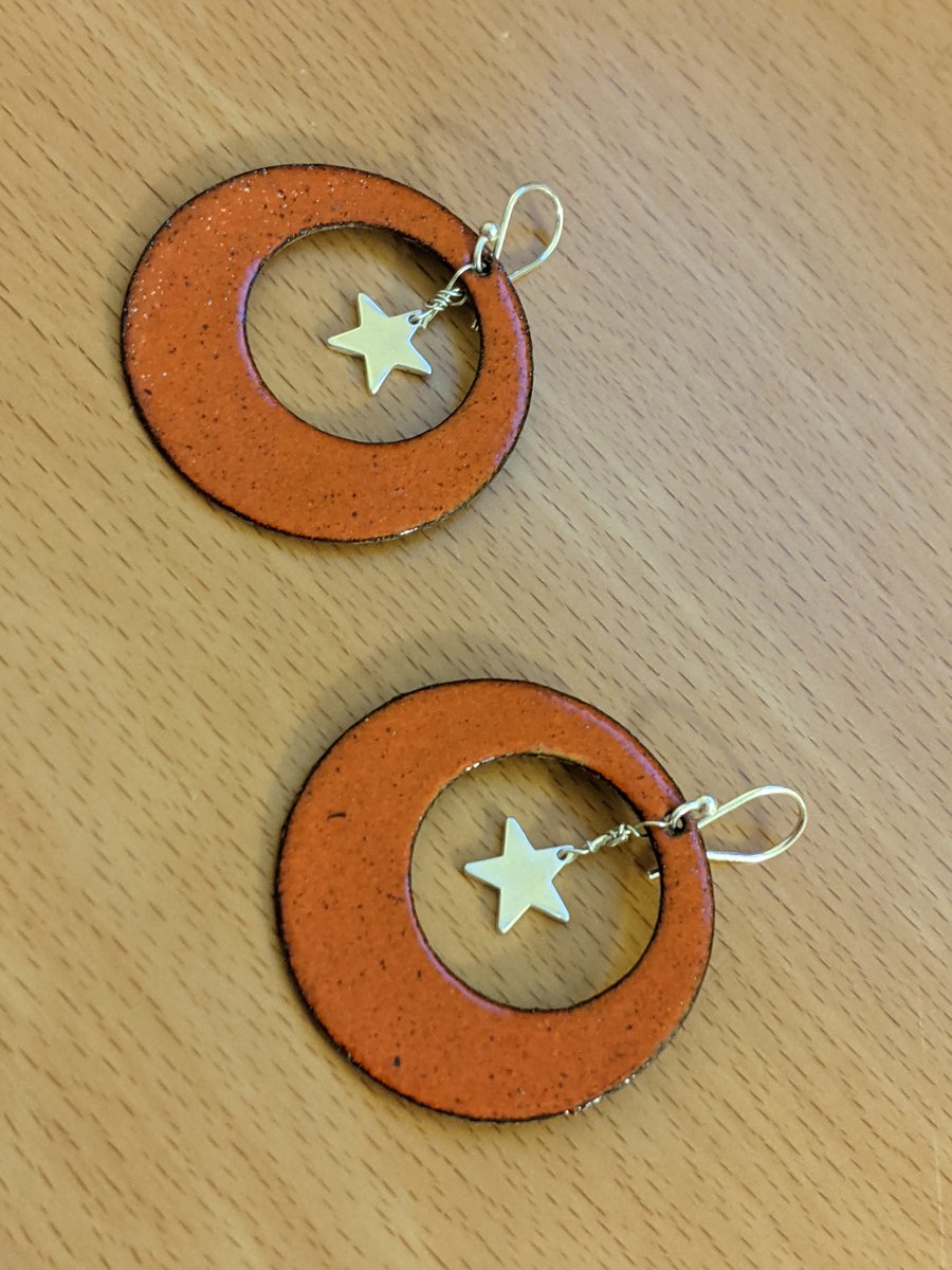 Orange enamel and silver star drop earrings