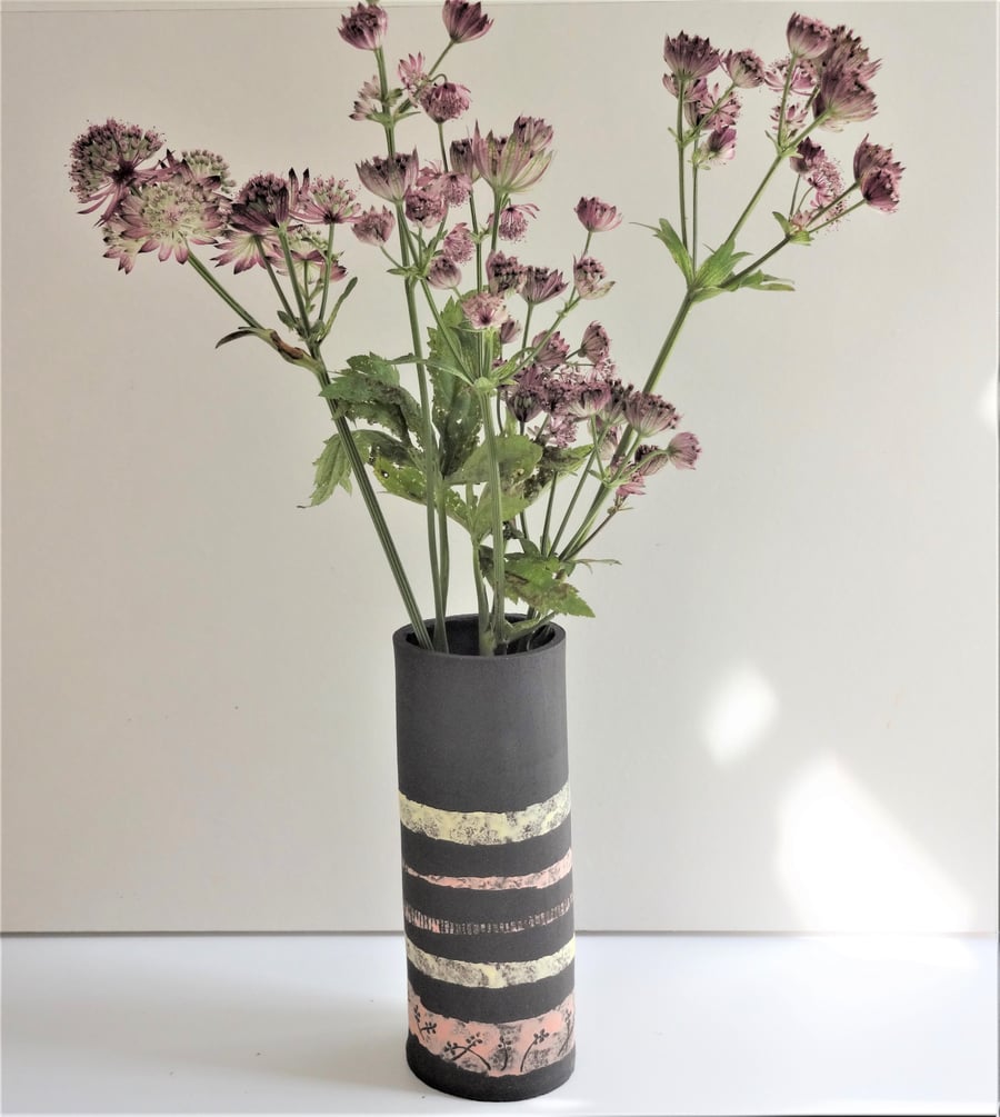 Zoe.  Handmade black ceramic vase with lemon and pink stripes and motifs