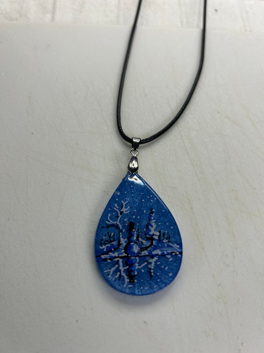 A hand painted and resin layered necklace pendant by Andrew Jenkins 