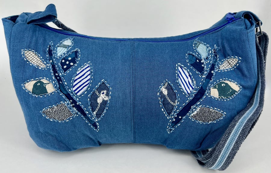 Handmade denim crescent cross body fully lined hobo bag with hand sewn applique 