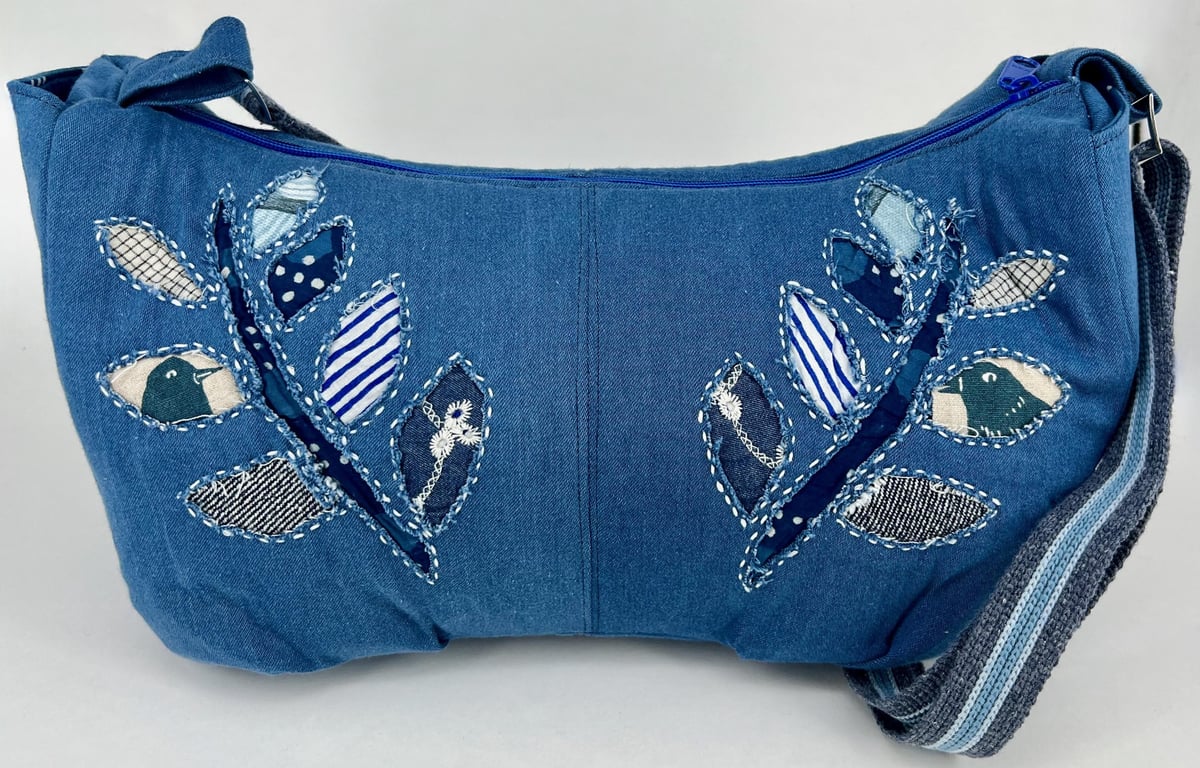 Handmade denim crescent cross body fully lined hobo bag with hand sewn applique 