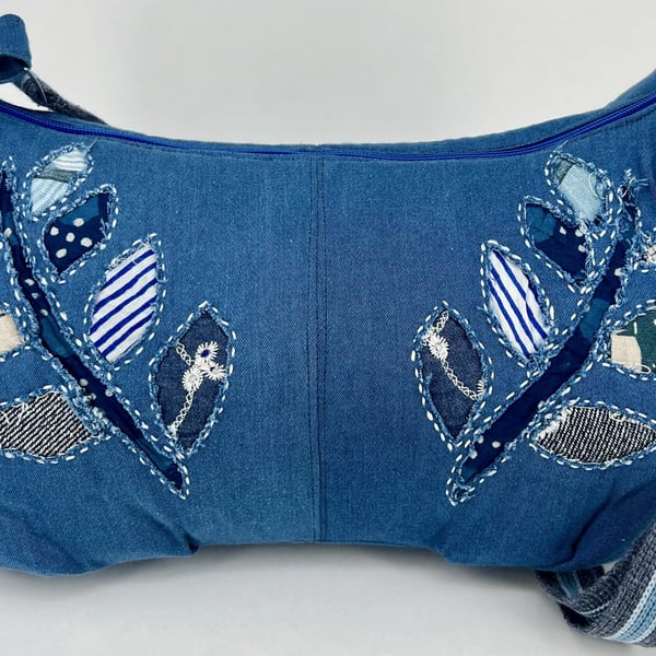 Handmade denim crescent cross body fully lined hobo bag with hand sewn applique 