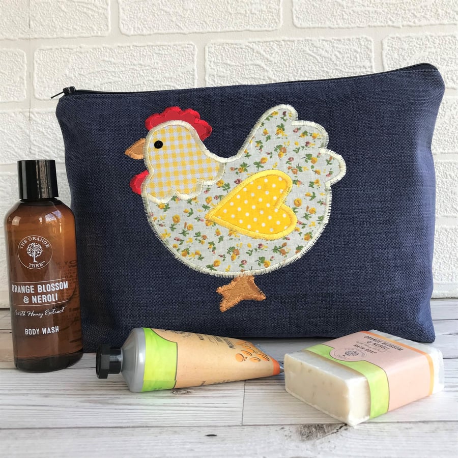 Chicken toiletry bag, wash bag in dark blue fabric with yellow floral chicken
