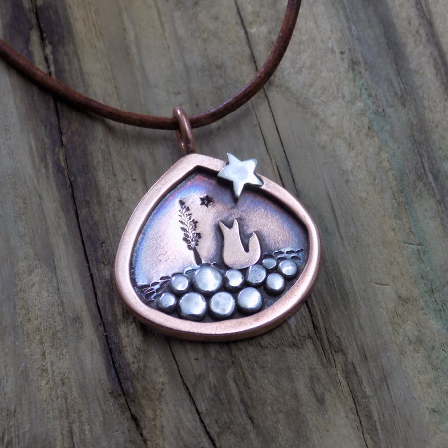 Copper and silver fox and star pendant 