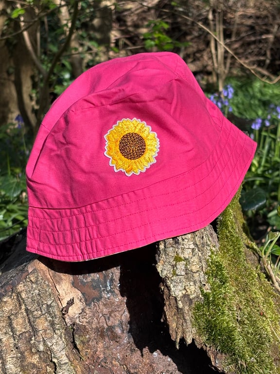 Pink and sunflower reversible bucket hat with large sunflower motif