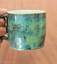 Stoneware pottery mug finished in a muli-colour green glaze - Image 2