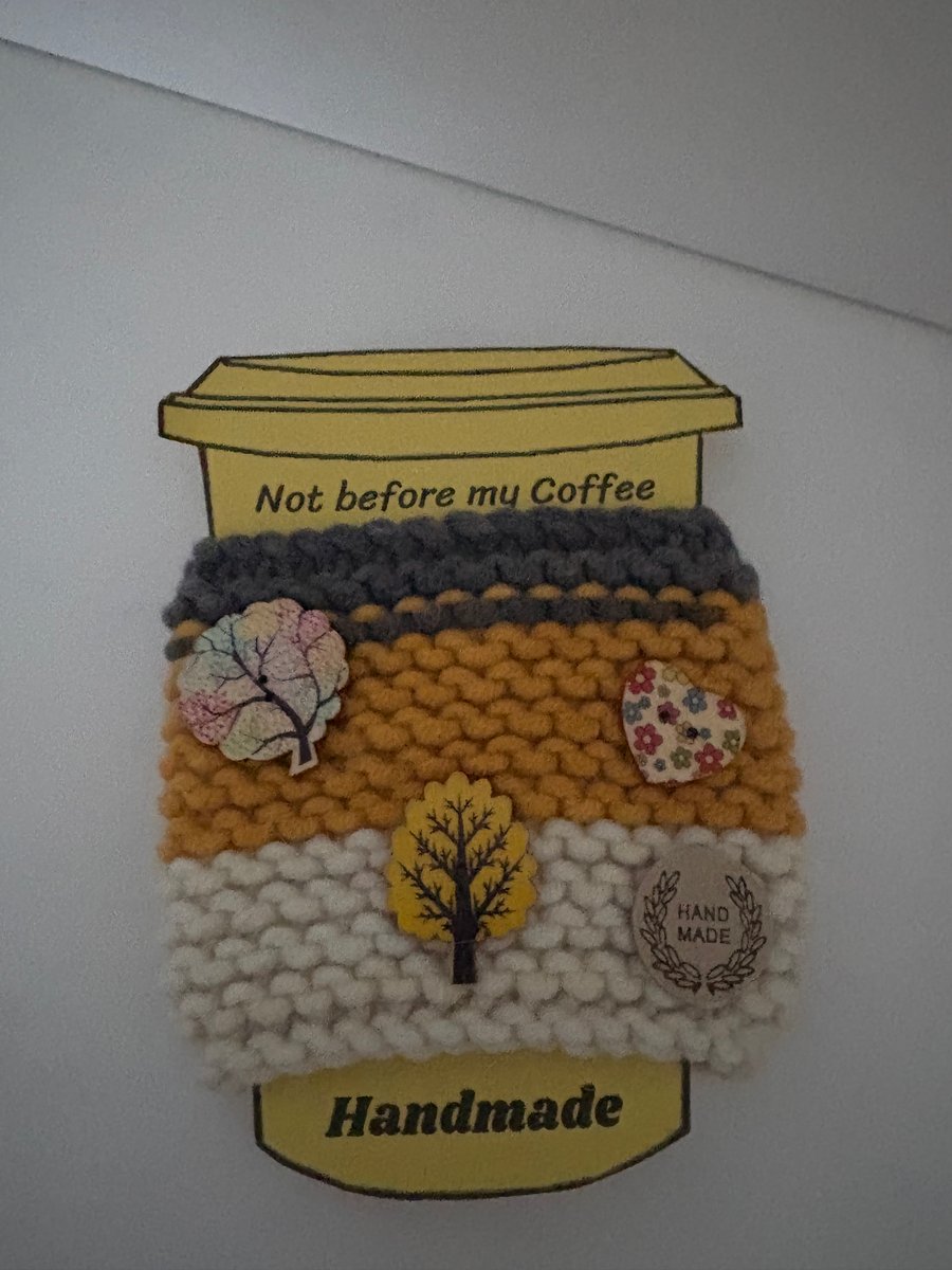Autumnal knitted cup cosy. 
