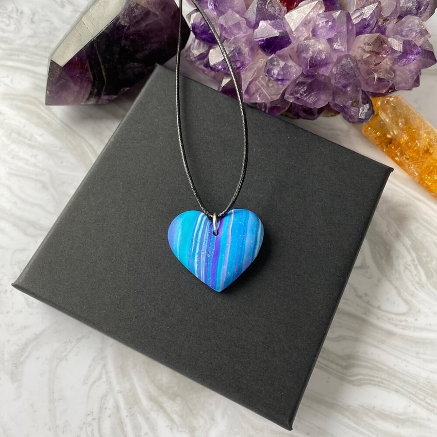 Striped heart necklace in purple and turquoise.