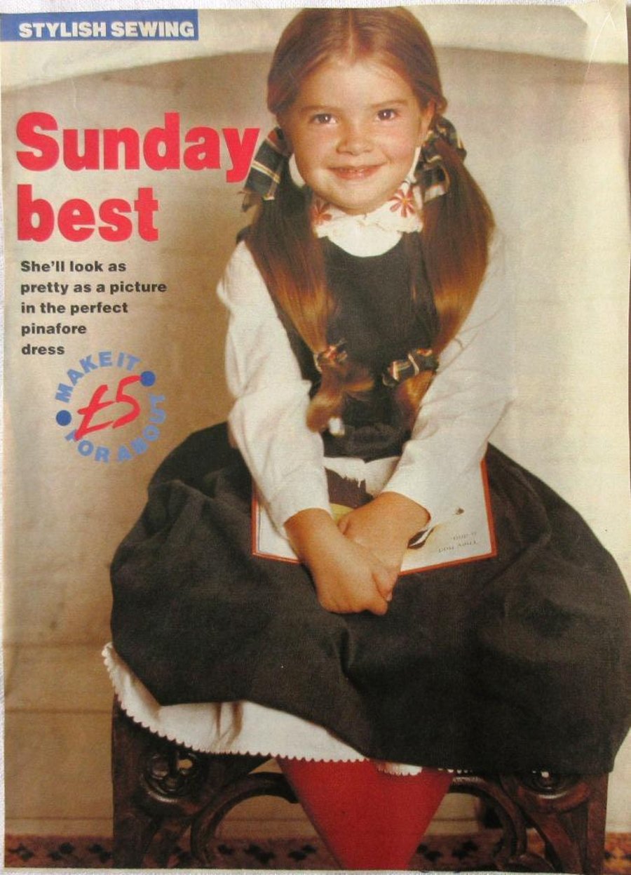 A multi-size sewing pattern for a little girl's pinafore dress in 4 sizes 