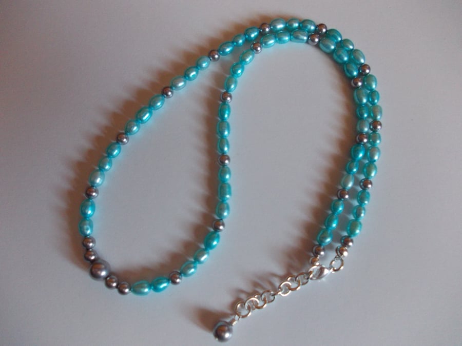 Teal freshwater culture pearl and silver shell pearl necklace