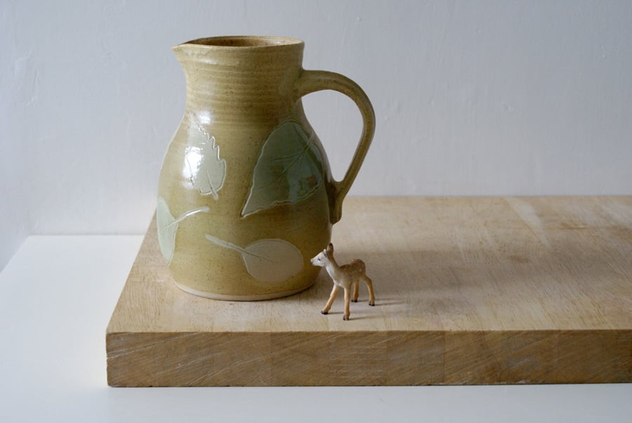 Handmade stoneware pouring jug with falling leaves - glazed in natural brown