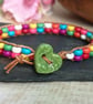 Multicoloured howlite bead and leather bracelet with green ceramic heart button - Image 3