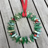 Luminesent glass wreath with berries 