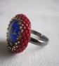 A Red and Gold Ring with a Blue and Gold Centre - Image 3