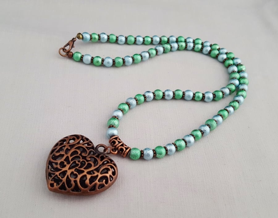 Shimmery blue and green bead necklace with copper heart pendant - 1001085