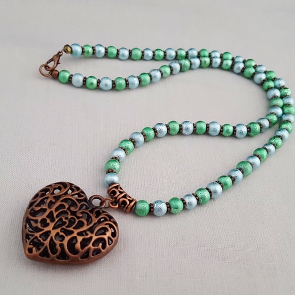 Shimmery blue and green bead necklace with copper heart pendant - 1001085
