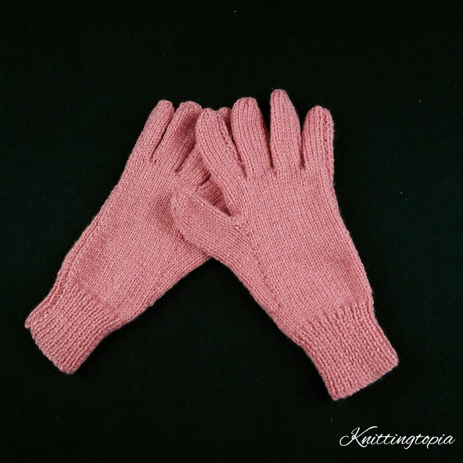 Hand knitted ladies gloves in coral pink orange yarn 