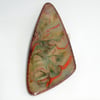 brooch: triangular - scrolled red, green, black on dove grey over clear enamel
