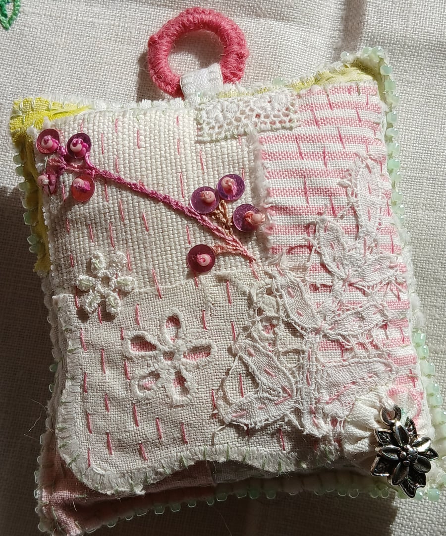The slow-stitched lavender sachet with a flower charm