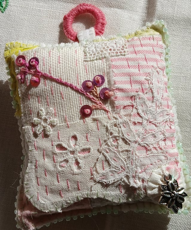 The slow-stitched lavender sachet with a flower charm