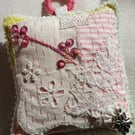 The slow-stitched lavender sachet with a flower charm