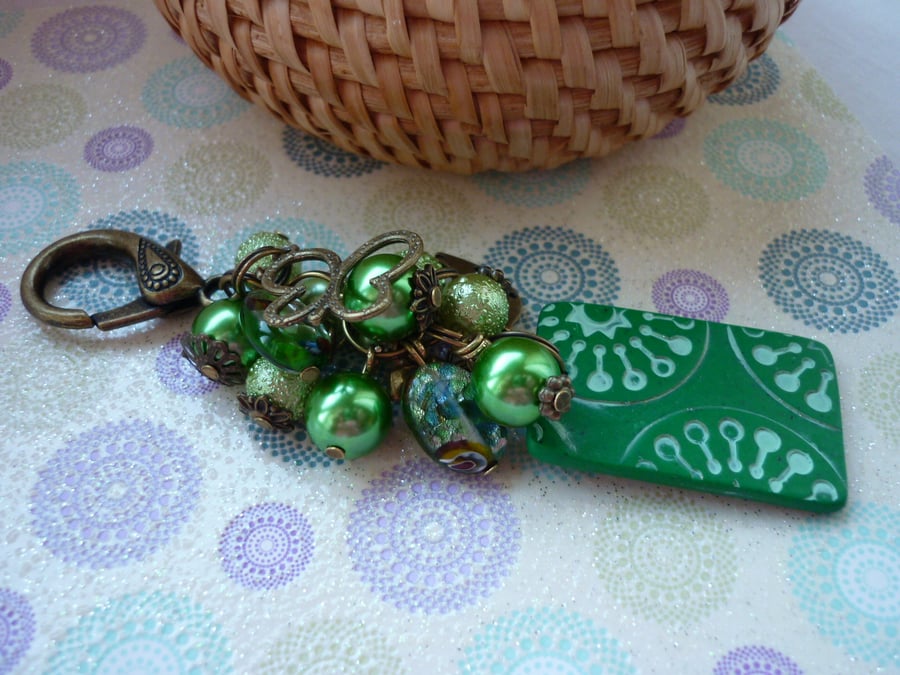 SHADES OF GREEN AND BRONZE HANDBAG CHARM.  949