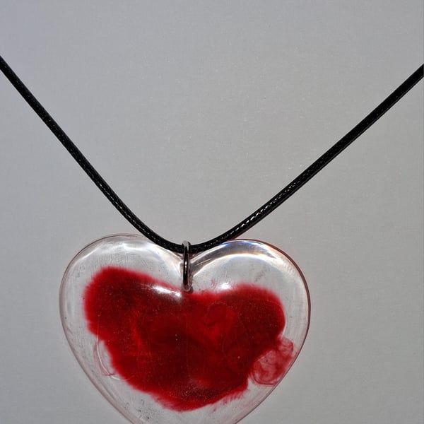 Handmade resin red heart pendant on  black waxed cord