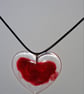 Handmade resin red heart pendant on  black waxed cord