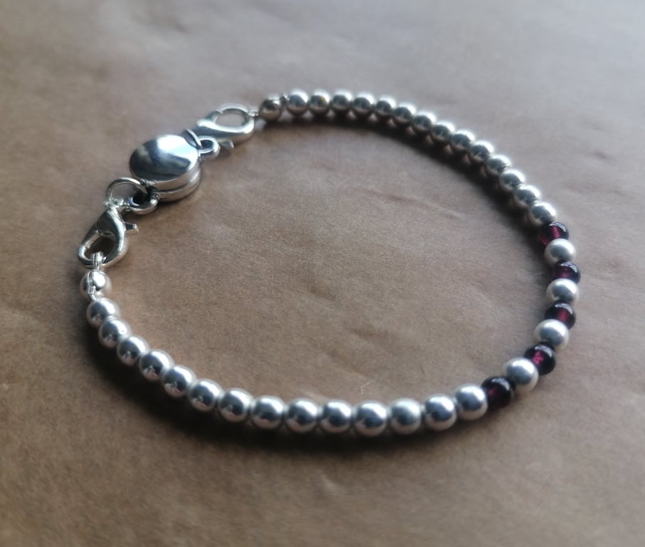 Silver and Garnet, complimentary magnetic clasp bracelet. 