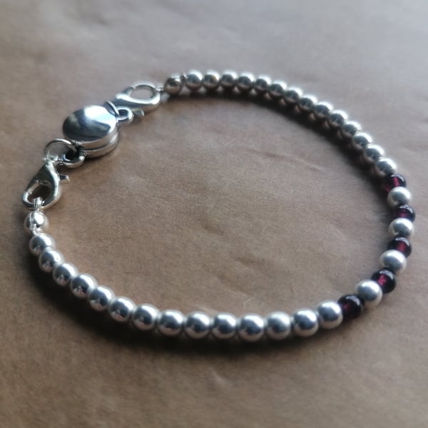 Silver and Garnet, complimentary magnetic clasp bracelet. 