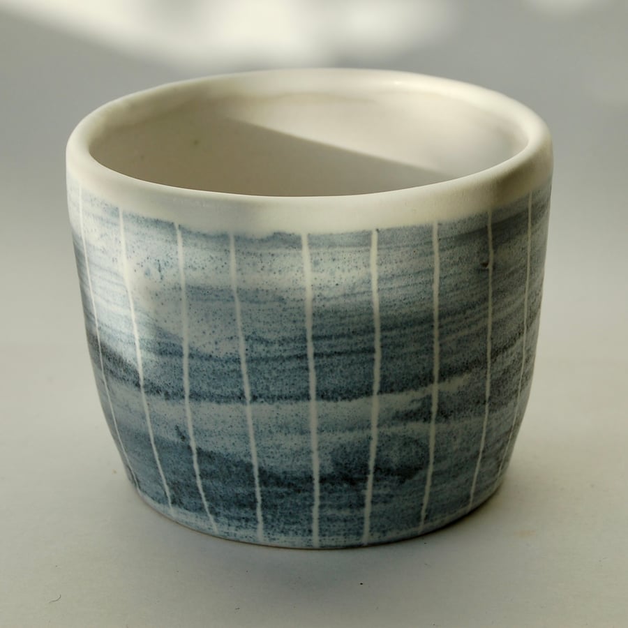 Art pottery cactus pot made from light stoneware with cobalt oxide decoration.