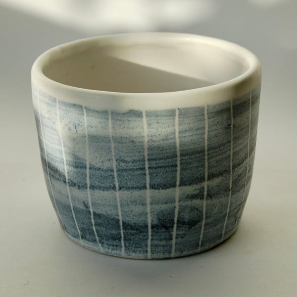 Art pottery cactus pot made from light stoneware with cobalt oxide decoration.