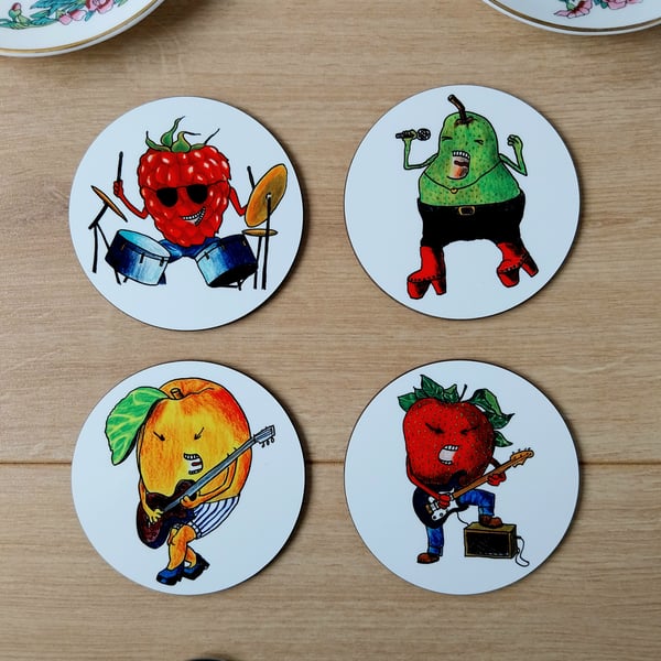 Set of four coasters with cartoon fruit characters playing instruments